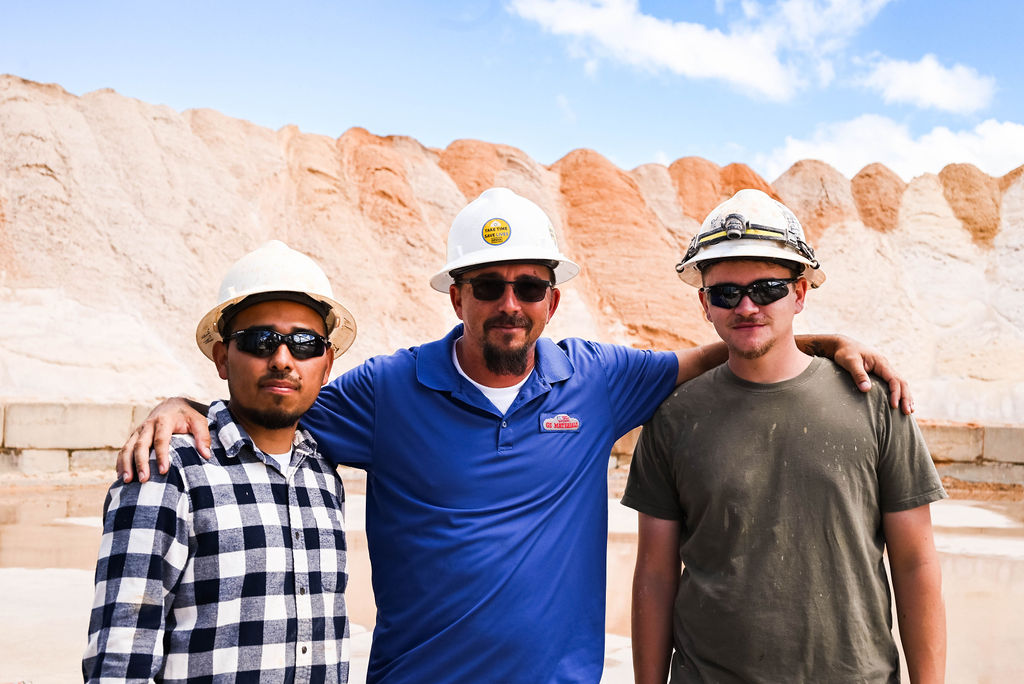 Meet part of the team, three men standing together smiling